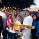 a family holding a giant key signifying the purchase of a home