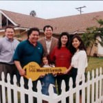 another family holding a giant key signifying the purchase of a home
